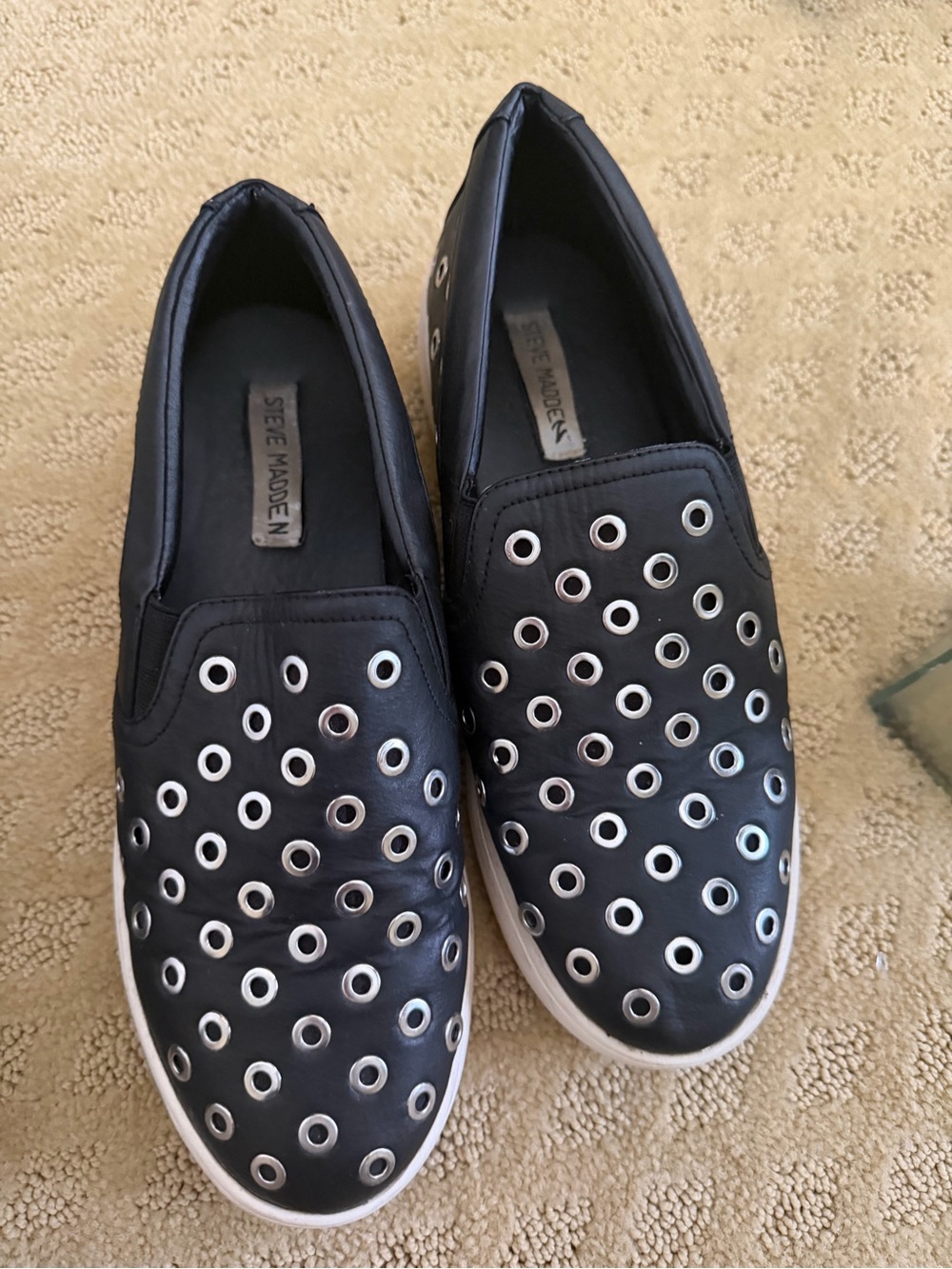 Steve Madden Black Slip-On Sneakers with Silver Eyelets